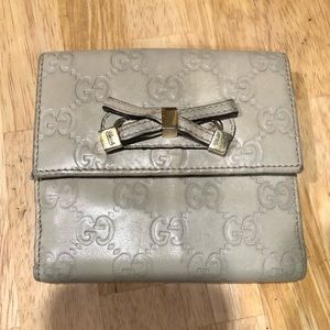 Gucci Off-White Guccissima Leather Bifold Wallet